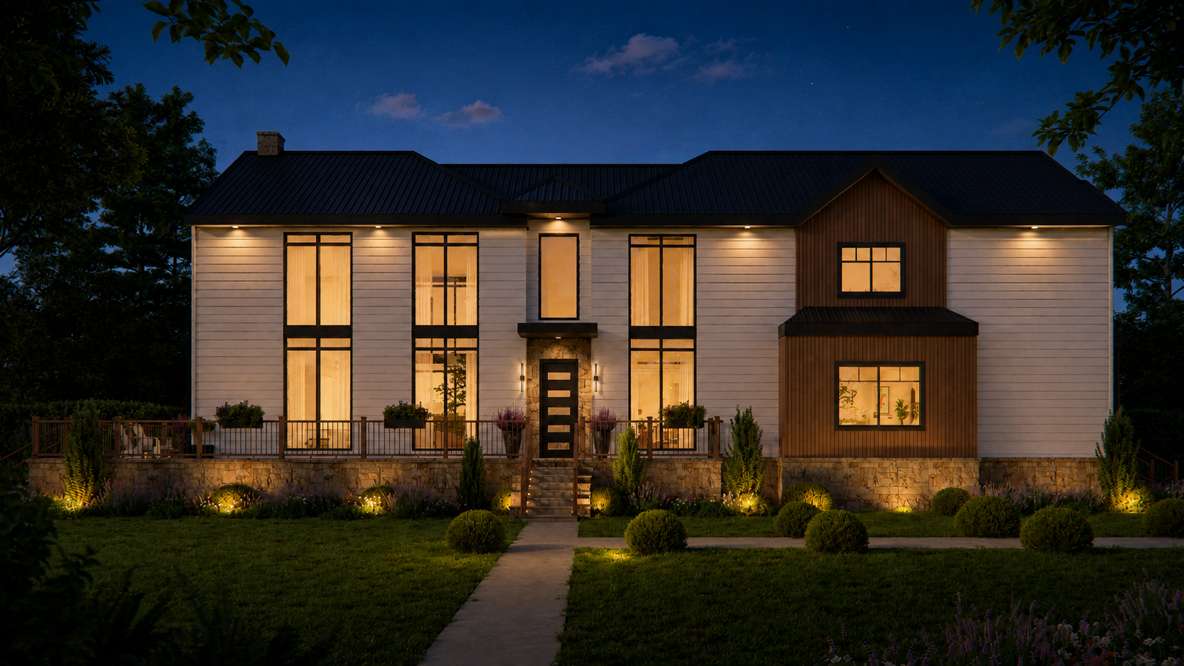 The Frazer Road summer home at night, windows glowing against a deep blue sky